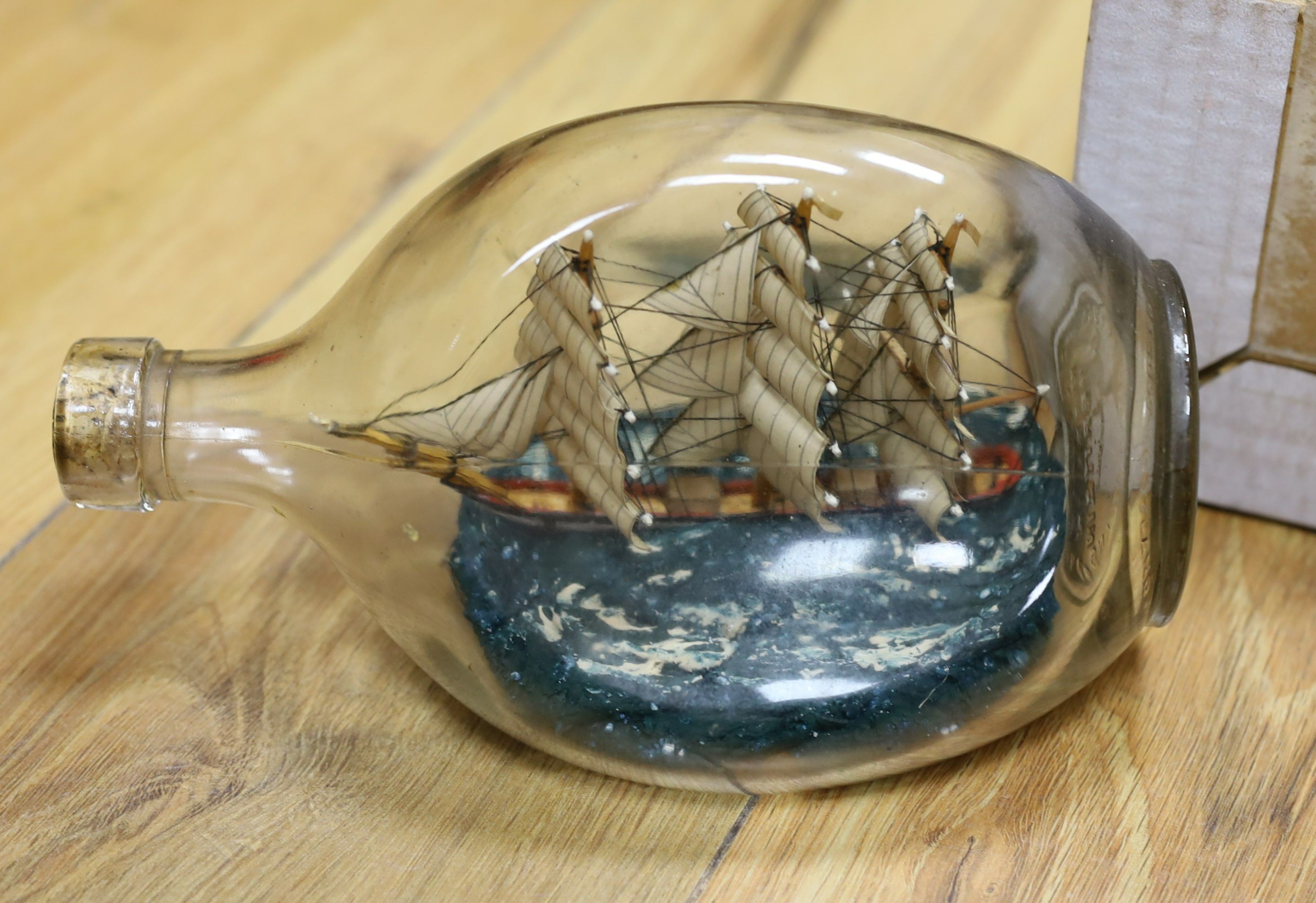 A silver plated meat dome, brass and copper measures, ship in a bottle, mixed collectables